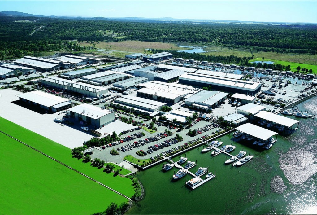 The giant production facility and marina of The Riviera Group photo copyright Riviera . http://www.riviera.com.au taken at  and featuring the  class