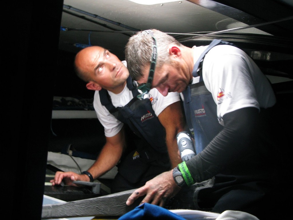 (l-r) Xabier Fernandez and Pepe Ribes attempt to repair steering damage to Telefonica Blue which occured shortly after the start of leg 1. © Gabriele Olivo/Telefonica Blue/Volvo Ocean Race http://www.volvooceanrace.org