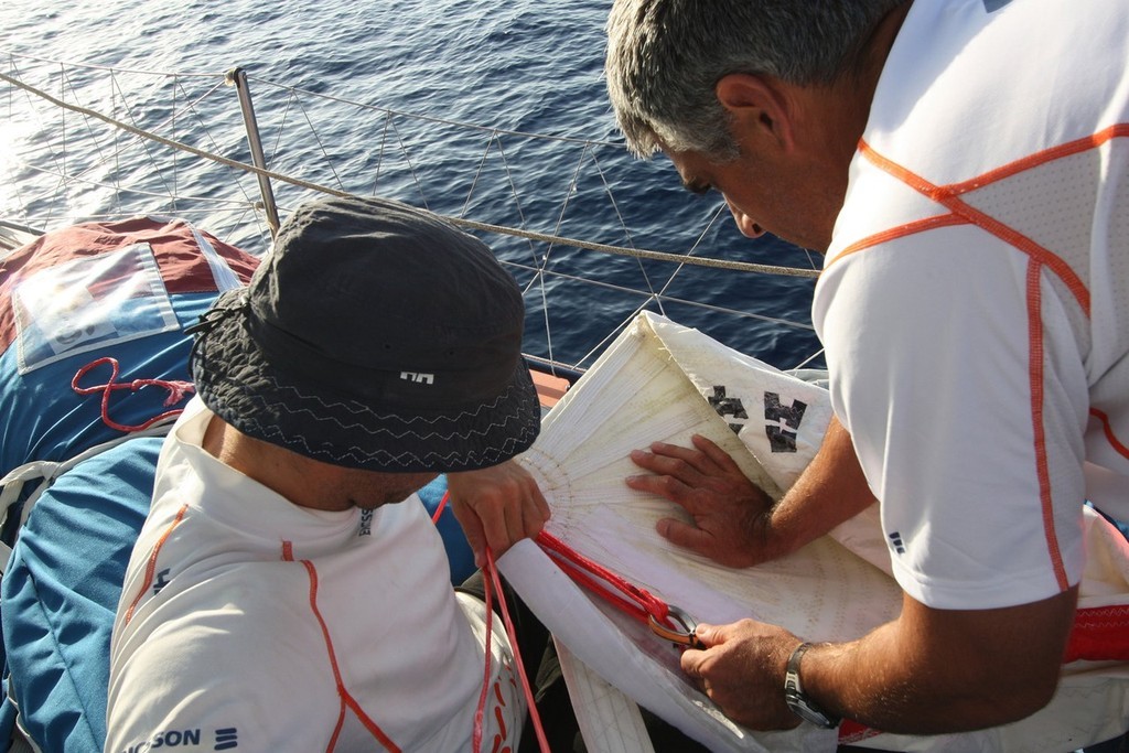 Guy Salter/Ericsson 4/Volvo Ocean Race: Ryan Godfrey and Horacio Carabelli adjust the luff rope on the A4 sail on leg 1 of the Volvo Ocean Race<br />
<br />
 © Volvo Ocean Race http://www.volvooceanrace.com