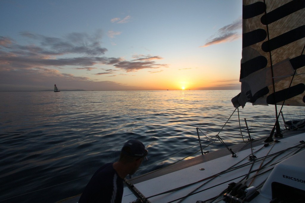 Guy Salter/Ericsson 4: Stuart Bannatyne (NZL) trimming at sunset with Ericsson 3 to leeward in extremely light winds on leg 1 of the Volvo Ocean Race<br />
<br />
 © Volvo Ocean Race http://www.volvooceanrace.com