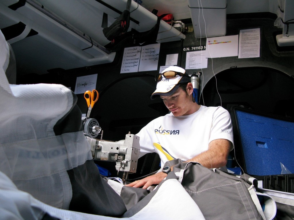 : Mark Covell/Team Russia: Jeremy Elliott below decks on Team Russia&rsquo;s Kosatka, fixing the A4 kite photo copyright Volvo Ocean Race http://www.volvooceanrace.com taken at  and featuring the  class