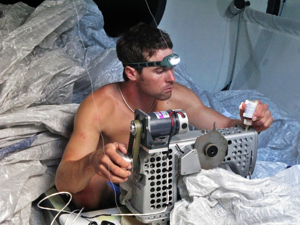 Gabriele Olivo/Telefonica Blue: 
Bowman/ Trimmer, Daryl Wislang repairs sails below decks on Telefonica Blue on leg 1 of the Volvo Ocean Race

 photo copyright Volvo Ocean Race http://www.volvooceanrace.com taken at  and featuring the  class
