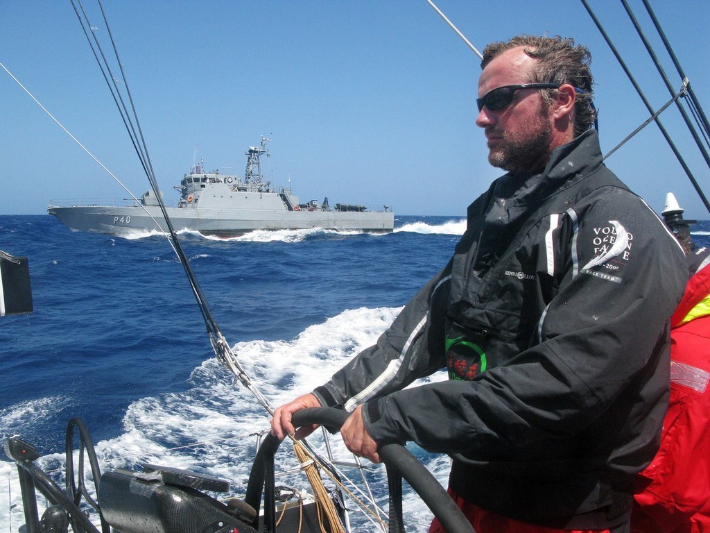 Guo Chuan/Green Dragon Racing/Volvo Ocean Race.<br />
Neal McDonald at the helm as Green Dragon are joined by a Brazilian naval vessel with a TV cameraman and stills pohotographer onboard to shoot them passing first through the scoring gate of Fernando de Noronha<br />
<br />
 © Volvo Ocean Race http://www.volvooceanrace.com