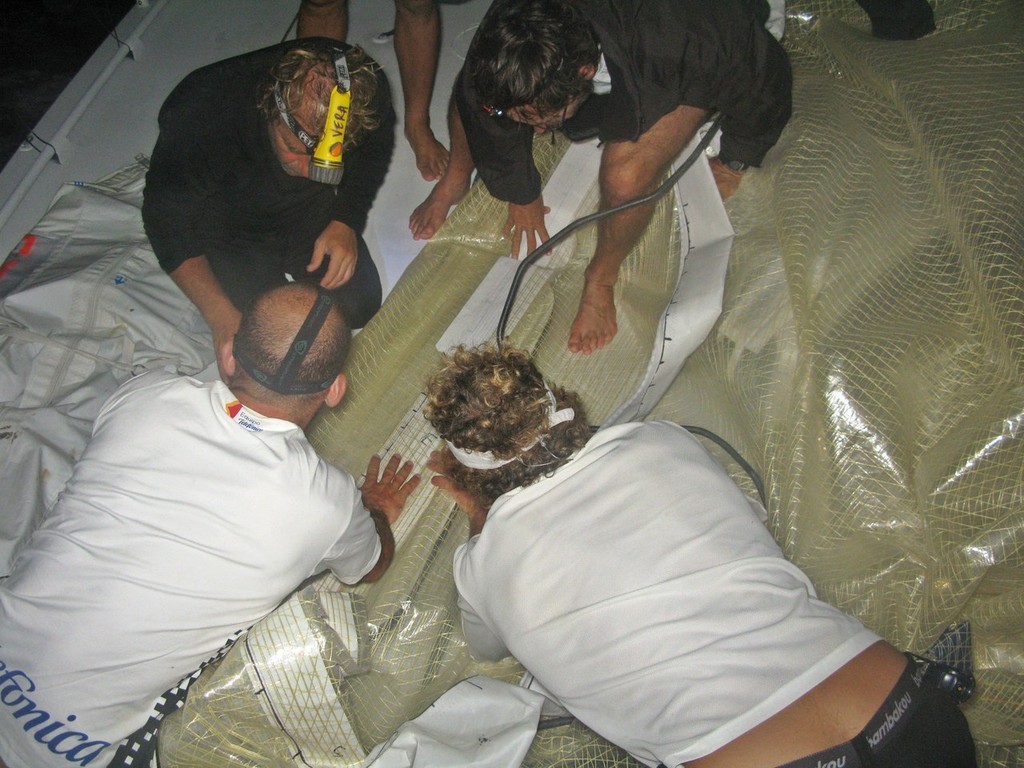 Mikel Pasabant/Equipo Telefonica/Volvo Ocean Race.<br />
The crew of Telefonica Black check and repair sails in preperation for some strong wind to Cape Town, on leg 1 of the Volvo Ocean Race<br />
<br />
 © Volvo Ocean Race http://www.volvooceanrace.com