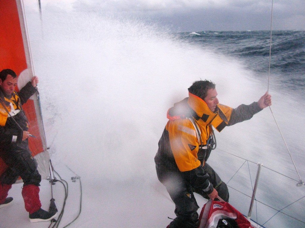 Gabriele Olivo/Telefonica Blue/Volvo Ocean Race<br />
(l-r) Iker Martinez and Pepe Ribes hang on as a huge wave hits Telefonica Blue, on leg 2 of the Volvo Ocean Race. © Gabriele Olivo/Telefonica Blue/Volvo Ocean Race http://www.volvooceanrace.org