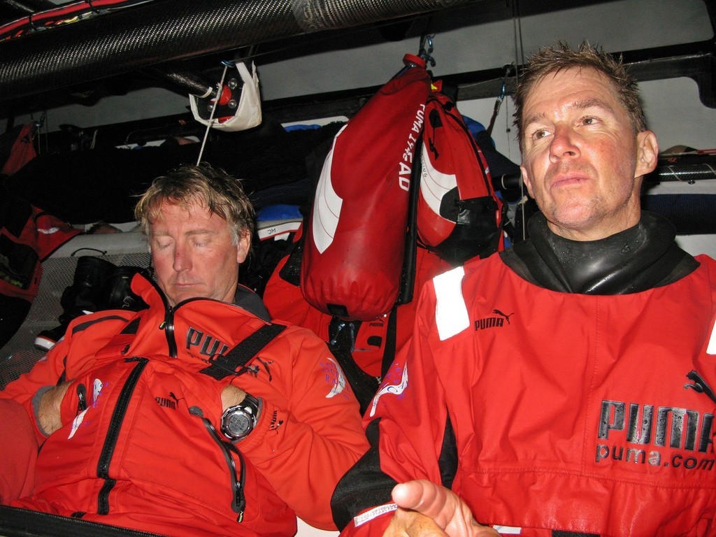  <br />
PUMA Ocean Racing Navigator Andrew Cape sleeps, whilst skipper Ken Read battles to stay awake at the navigation station, on leg 2 of the Volvo Ocean Race, from Cape Town, South Africa to Cochin, India  © Rick Deppe/PUMA Ocean Racing/Volvo Ocean Race http://www.volvooceanrace.org
