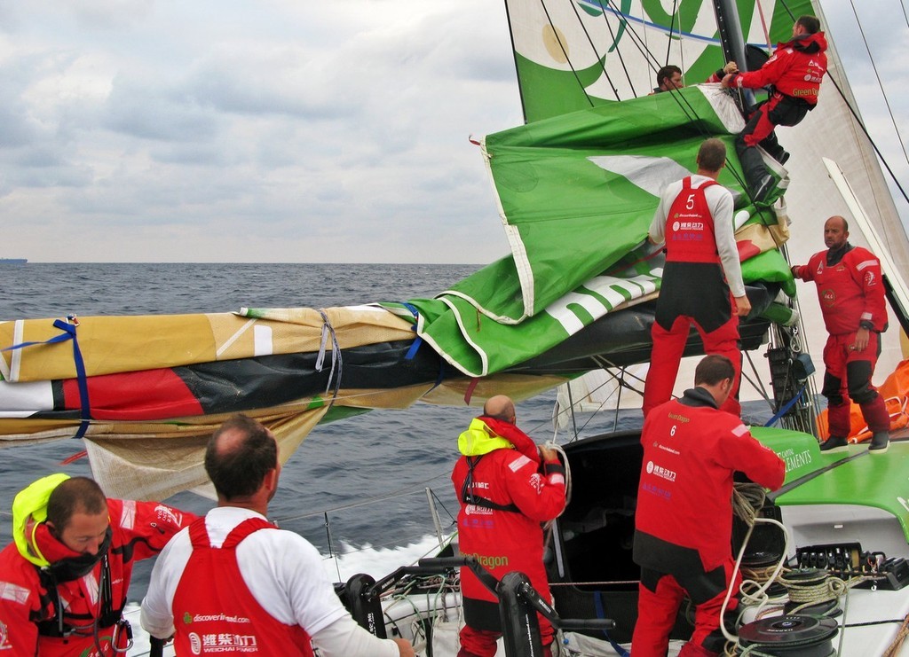 Green Dragon changes to storm sails in rough weather on leg 4 of the Volvo Ocean Race from Singapore to Qingdao, China. Handling sails like this is very hard on sailbattens which must be super reliable. © Guo Chuan/Green Dragon Racing/Volvo Ocean Race http://www.volvooceanrace.org