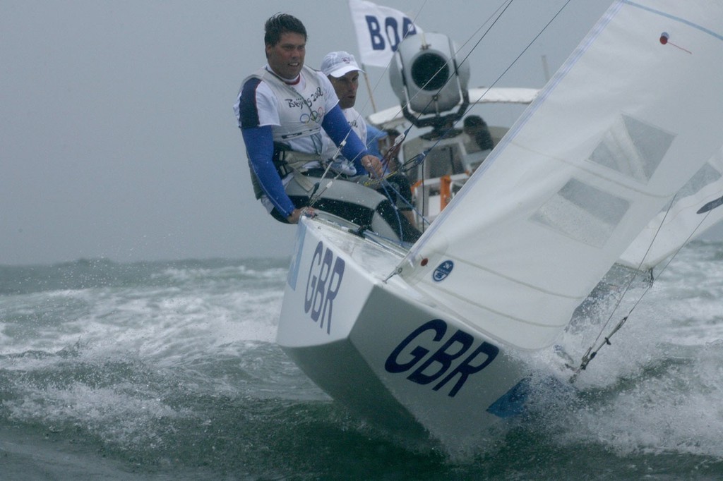 Qingdao Olympic Regatta 2008. Don’t look back!  (It’s only a broadcast camera).Qingdao Olympic Regatta 2008. Percy and Simpson (GBR) negotiate the spectator chop after claiming gold in the medal race. © Guy Nowell http://www.guynowell.com