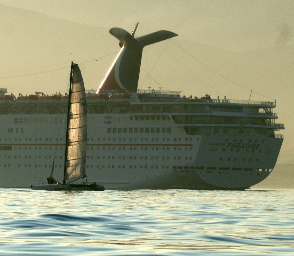 Cruise ship escorts Afterburner across line  - 61st Newport to Ensenada Race  © Rich Roberts http://www.UnderTheSunPhotos.com