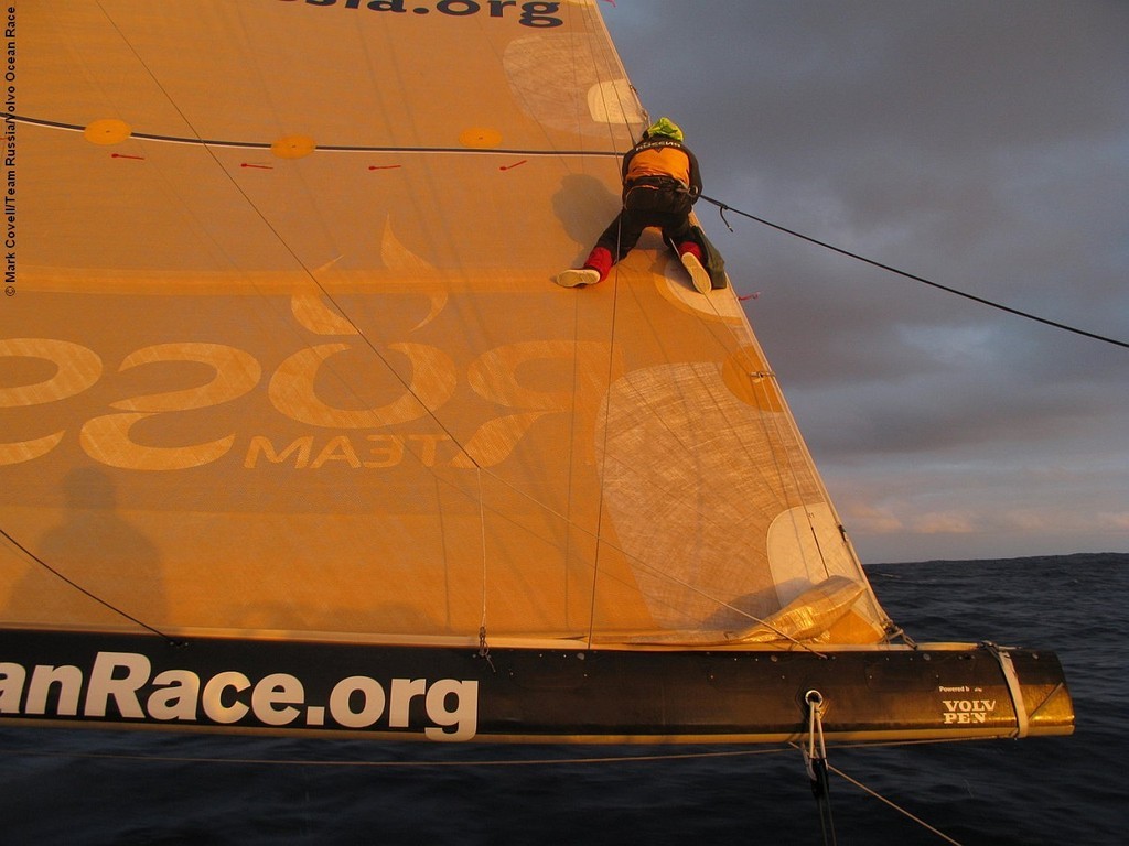 Ben Costello, fixing the mainsail onboard Team Russia, on leg 2 of the Volvo Ocean Race photo copyright Mark Covell/Team Russia/Volvo Ocean Race http://www.volvooceanrace.org taken at  and featuring the  class