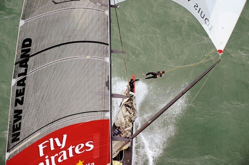 Richard Meacham goes out to the end of the pole aboard NZL84. Emirates Team New Zealand trail Alinghi down the first run of the first final of the Louis Vuitton Pacific Series. © Chris Cameron/ETNZ http://www.chriscameron.co.nz