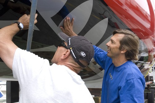 Emirates Team New Zealand CEO Grant Dalton and designer Marcelino Botin (right) check the finish on the new TP52 delivered to the teams base in February 2009 © Chris Cameron/ETNZ http://www.chriscameron.co.nz