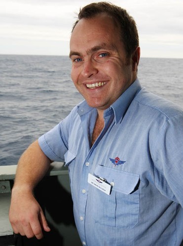 Doctor David McIlroy, Royal Flying Doctors Service,  stands on the starboard bridgewing as HMAS Arunta sails towards the yacht ’Generali’, preparing to render assistance to the injured yachtsman on board. Photography by Able Seaman Photographer Lincoln Commane. © Commonwealth of Australia