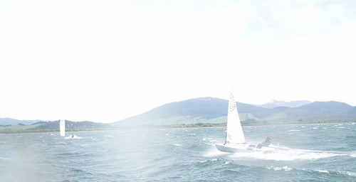 Brad Douglas (NZL539) downwind in 30 knots © SW