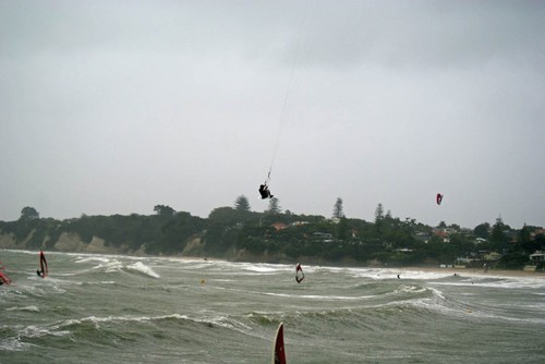 Windsurfing coach and Kiteboarder, David Robertson flying high at in 40kts at Takapuna Beach, NZ © Richard Gladwell www.photosport.co.nz