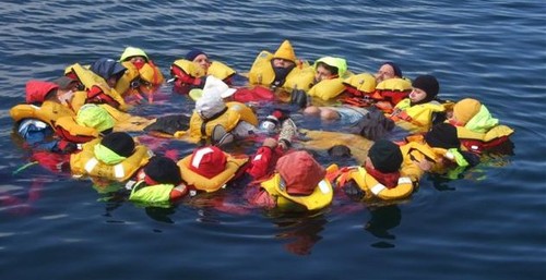 Med_Sea%20Safety%20Survival%20-%20practising%20'The%20Huddle'%20heat%20preservation%20exercise.jpg