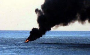 Pirate vessel alight off Somalia coast © SW