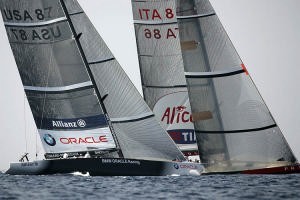 A close cross between BMW ORACLE vs Luna Rossa on Day 5 of Louis Vuitton Act 12 photo copyright BMW Oracle Racing Photo Gilles Martin-Raget http://www.bmworacleracing.com taken at  and featuring the  class