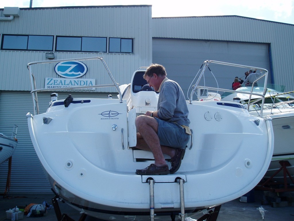 Neil Cullen boat builder works on the new Bavaria 33 in the Viaduct Harbour photo copyright Jane Pares - IMB taken at  and featuring the  class