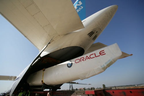 Disgorging the beast - BMW Oracle Racing’s new boat reappears from the throat of the Antonov after landing in Spain. © BMW Oracle Racing Photo Gilles Martin-Raget http://www.bmworacleracing.com