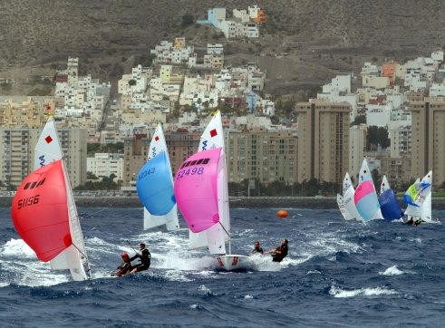The fleet struggles in the big waves and fresh winds that prevailed for the second day of racing © Event Media