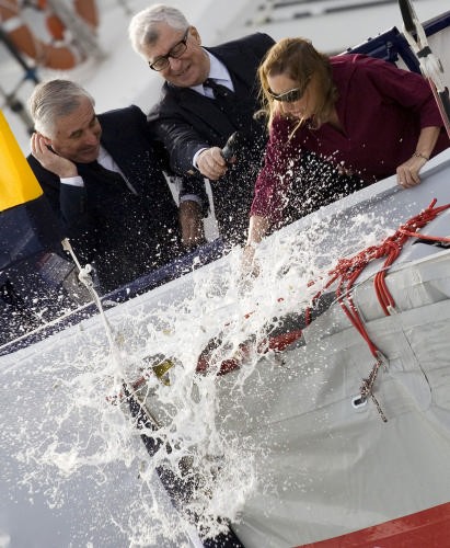 Miuccia Prada smashes a bottle of Gran Cuvée Brut 2002, a Franciacorta from the Bellavista wine cellars, on the bow of the new boat, with her husband Patrizio Bertelli at her side. © Luna Rossa Challenge 2007 S.L.@ Carlo Borlenghi