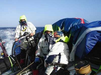 Damien Foxall and Tom Braidwood having a chat..... Woxen on helm of Volvo Open 70 Ericsson crewmember is well protected©Magnus Woxén  © Volvo Ocean Race http://www.volvooceanrace.com