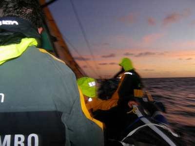 Crew on deck onboard ABN AMRO ONE are prepared for a rain squall. Volvo Ocean Race Leg 5 from Rio to Baltimore.  © Volvo Ocean Race http://www.volvooceanrace.com