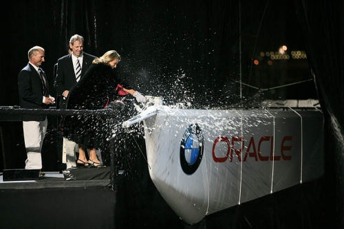 Sue Dickson breaks the traditional bottle champagne over the bow uf USA-87 © BMW Oracle Racing Photo Gilles Martin-Raget http://www.bmworacleracing.com