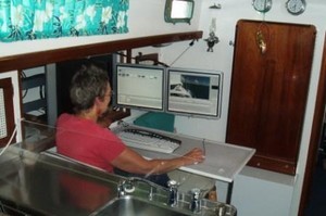 2  Kay editing their Cruising NZ DVD aboard Mai Tai - Reach for the Sea photo copyright jane pares taken at  and featuring the  class