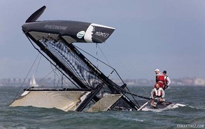 ``BMW ORACLE Racing Spithill`` skipper James Spithill (AUS) on one of the hull of catamaran, as boat just capsize - iShares Cup Skandia Cowes Week photo copyright ThMartinez http://www.thmartinez.com/ taken at  and featuring the  class