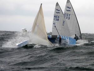 Harmut Duisberg, GER (capsized) with Deniss Karpak, EST and Karel van Hellemond, NED - 2009 Finn Cup Day 5 photo copyright The Daily Sail.com taken at  and featuring the  class