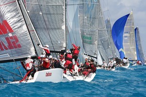 Sunday&rsquo;s racing produced some intense mark rounding scenes, including this one where Joe Woods on &rsquo;Red&rsquo; and Stephen Pugh on &rsquo;Taboo&rsquo; rush to set the kites. photo copyright JOY / IM32CA http://melges32.com/ taken at  and featuring the  class