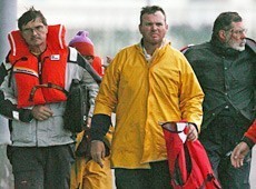 Air Apparent crew after rescue - Skipper Bill Heritage left with John Lammin photo copyright SW taken at  and featuring the  class