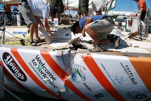 Austen Brierley and Justin Haller from the Clipper shore team begin assessing the damage to Hull & Humber after a collision with Cork at the start of race 4 of the Clipper Race 09-10 from Cape Town, South Africa to Geraldton, Western Australia. photo copyright Clipper Ventures PLC . http://www.clipperroundtheworld.com taken at  and featuring the  class