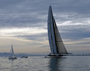 Like a painted ship on a painted ocean - USA-17 doing 22kts while the smaller yacht is in windless conditions - Practice Day, 2010 America’s Cup photo copyright Richard Gladwell www.photosport.co.nz taken at  and featuring the  class