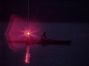 Laser flare at night photo copyright SW taken at  and featuring the  class