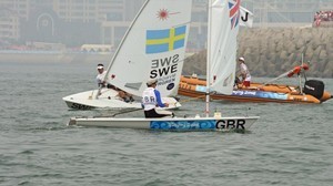 Paul Goodison rounds the first mark ahead of Rasmus Myrgren (SWE) after Goodison match raced his nearest rival off the Medal race course in the Mens Laser class 2008 Olympics photo copyright Richard Gladwell www.photosport.co.nz taken at  and featuring the  class