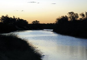 Lake Eyre - water flowing down Warburton Creek heading for the Lake photo copyright SW taken at  and featuring the  class