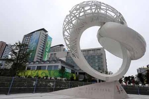 One World Statue in Qingdao photo copyright Xinhua - China Daily taken at  and featuring the  class