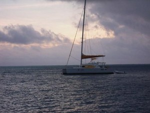 Our catamaran at sunset photo copyright www.takingthekids.com taken at  and featuring the  class