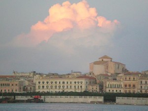 Thunderstorms on Sicilys horizon over Siracusas Old Town photo copyright Yacht Balvenie taken at  and featuring the  class