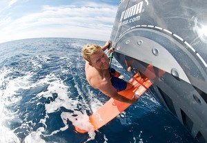Casey Smith examines the right rudder on il mostro photo copyright Rick Deppe/PUMA Ocean Racing/Volvo Ocean Race http://www.volvooceanrace.org taken at  and featuring the  class