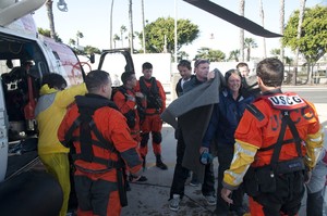 SAN DIEGO - Crewmembers from the sailing vessel Crosswave disembark from a MH-60J Jayhawk helicopter at Coast Guard Sector San Diego, Wednesday, Oct. 28, 2009. The five crewmembers were rescued when their 40-foot sailing vessel sank during the annual Baja-ha-ha sailboat race. (U.S. Coast Guard photo/Petty Officer 3rd Class Henry G. Dunphy) photo copyright SW taken at  and featuring the  class