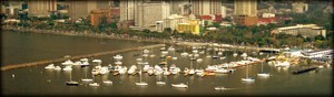 Manila Yacht Club. Not a lot of masts... photo copyright George Layton taken at  and featuring the  class