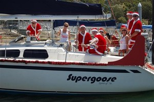 Team Santa’s Bitches getting ready for the start in the big pre-christmas afternoon Pursuit Race. The on board party went on until past midnight! Mini Santa outfits seemed to be a popular choice for the ladies, with the post race party staying noisy until after midnight!t - Contender Worlds 2010 photo copyright Contender Worlds 2010 http://www.contenderworlds2010.com taken at  and featuring the  class