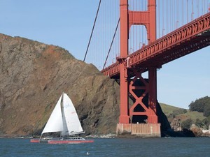 The home-made trimaran sails under the Golden Gate Bridge photo copyright Peter Lyons . http://www.lyonsimaging.com/ taken at  and featuring the  class