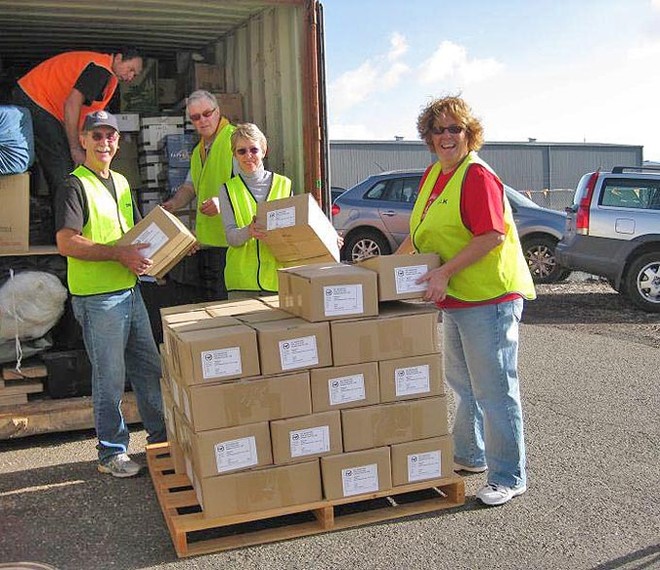 The team pile in a whole lot of diaries. - Melbourne to Vanuatu ©  John Curnow