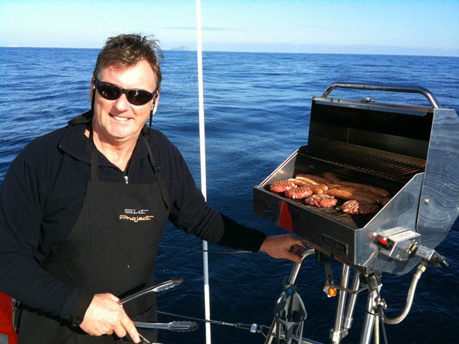 Phil Coombs goes from Skipper to Chef in a single bound. No sign of the Telephone Box... - Melbourne to Vanuatu ©  John Curnow