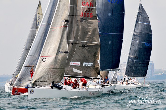 Competitors pass the commitee boat at the start of the Lake Ontario 300  © Jeff Chalmers